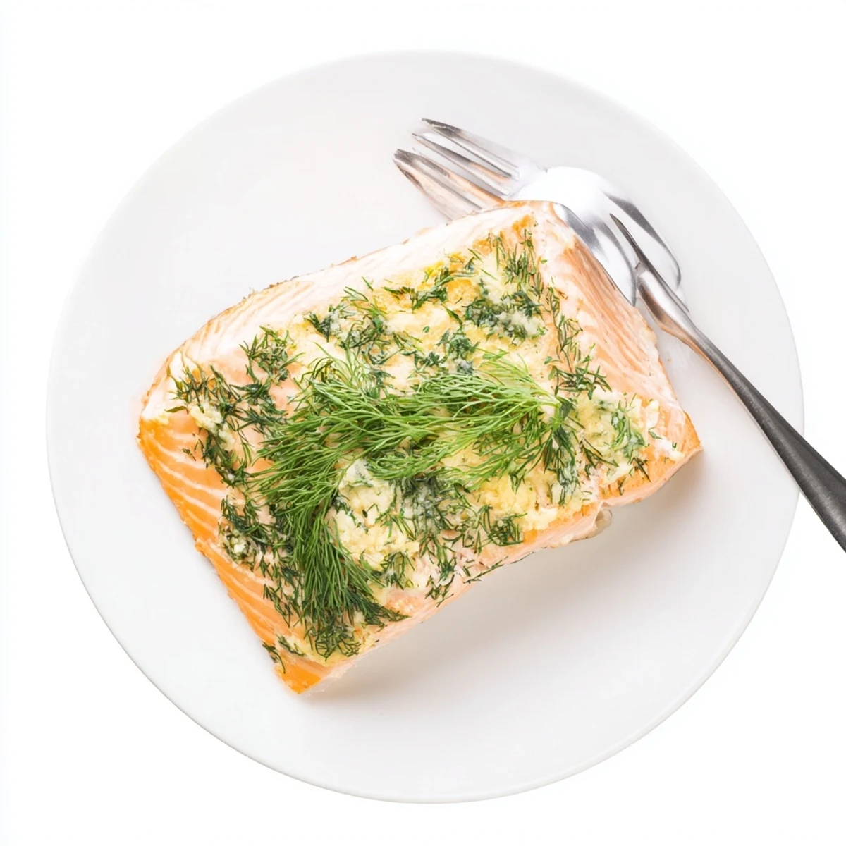 Golden-baked salmon fillets glistening with dill butter, served alongside roasted asparagus and a lemon wedge.