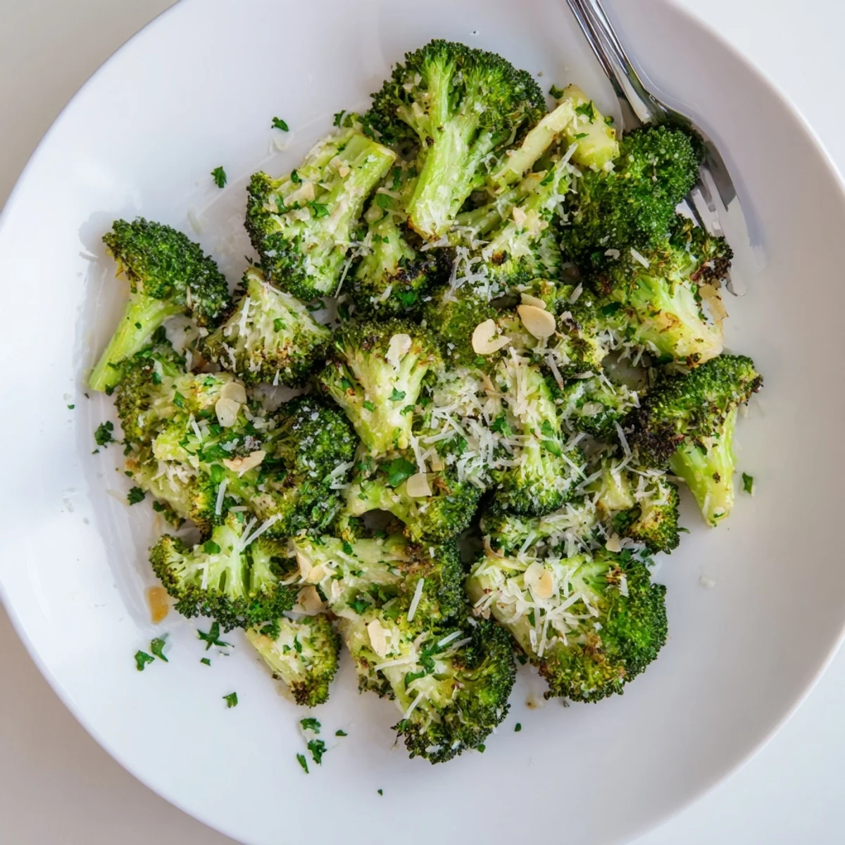 Golden roasted broccoli with garlic and Parmesan, served warm as a savory side dish for dinner.