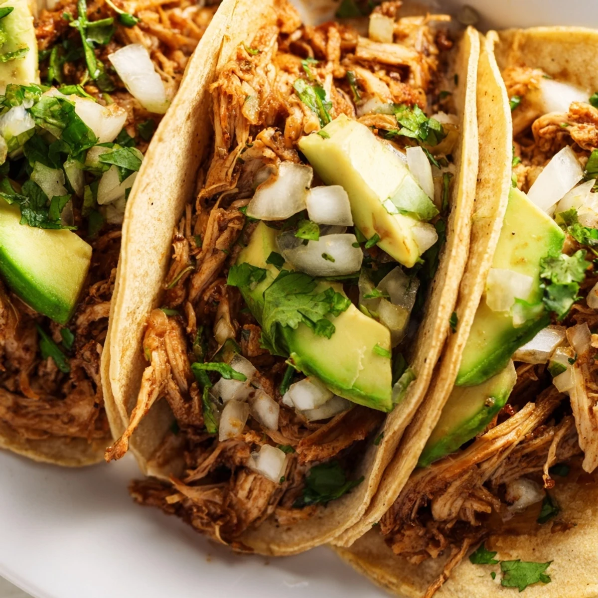 Golden, sizzling chicken and diced onions piled into warm corn tortillas, garnished with cilantro for delicious Chicken Street Tacos.