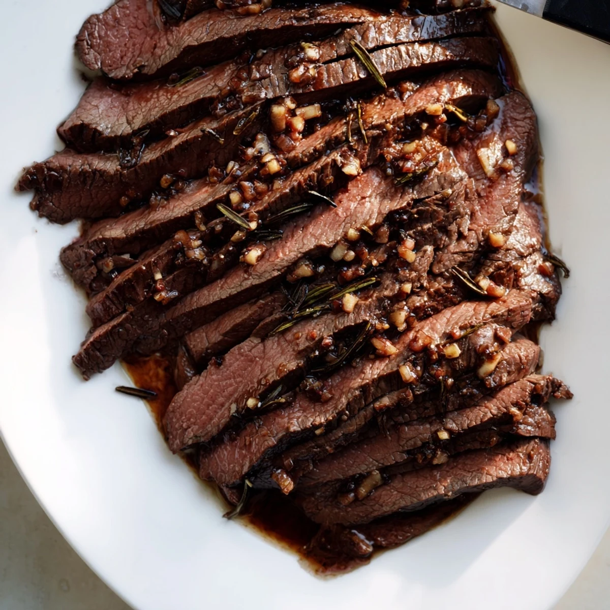 Grilled flank steak with zucchini and whipped feta on a platter, sliced thin for a Mediterranean dinner. Balsamic Flank Steak With Grilled Zucchini And Whipped Feta