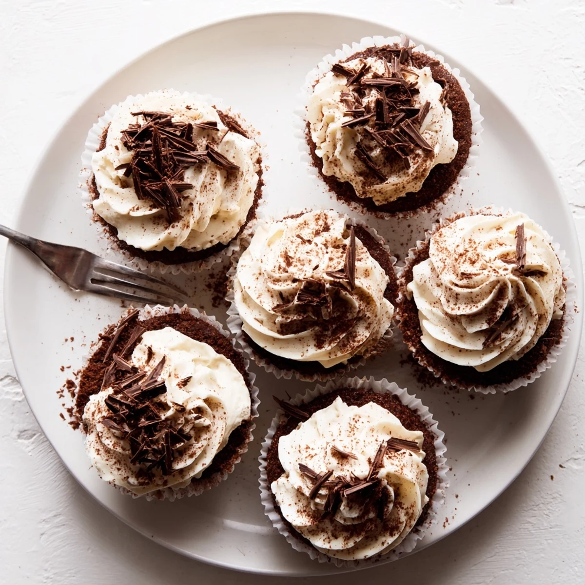 Italian-inspired chocolate tiramisu cupcakes with coffee-soaked cake and smooth mascarpone cream topping