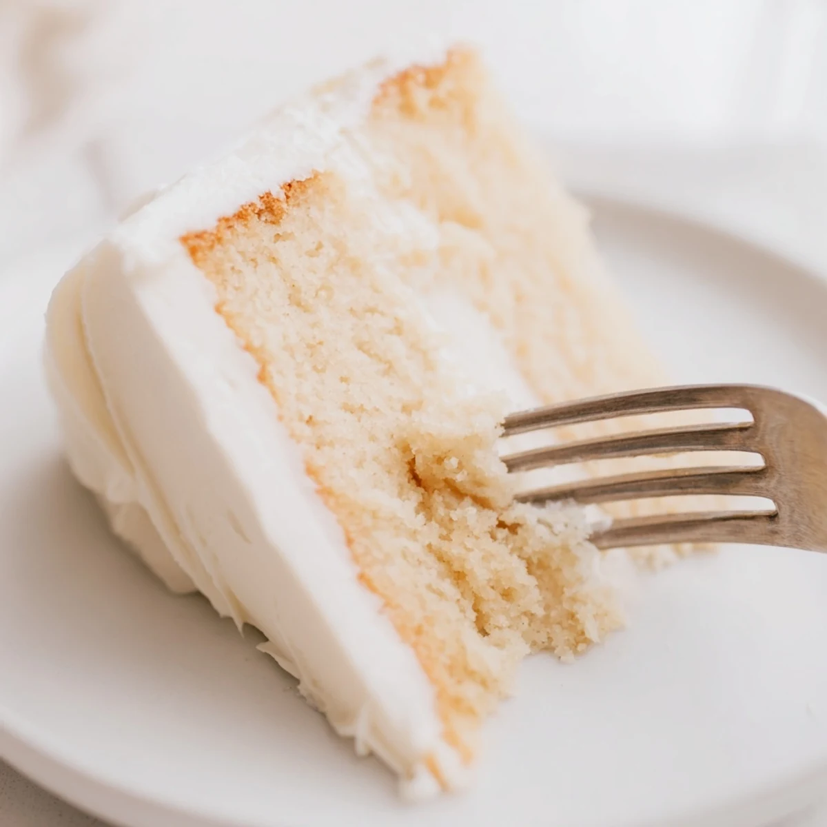 Sliced church cake on serving platter surrounded by coffee cups and guests