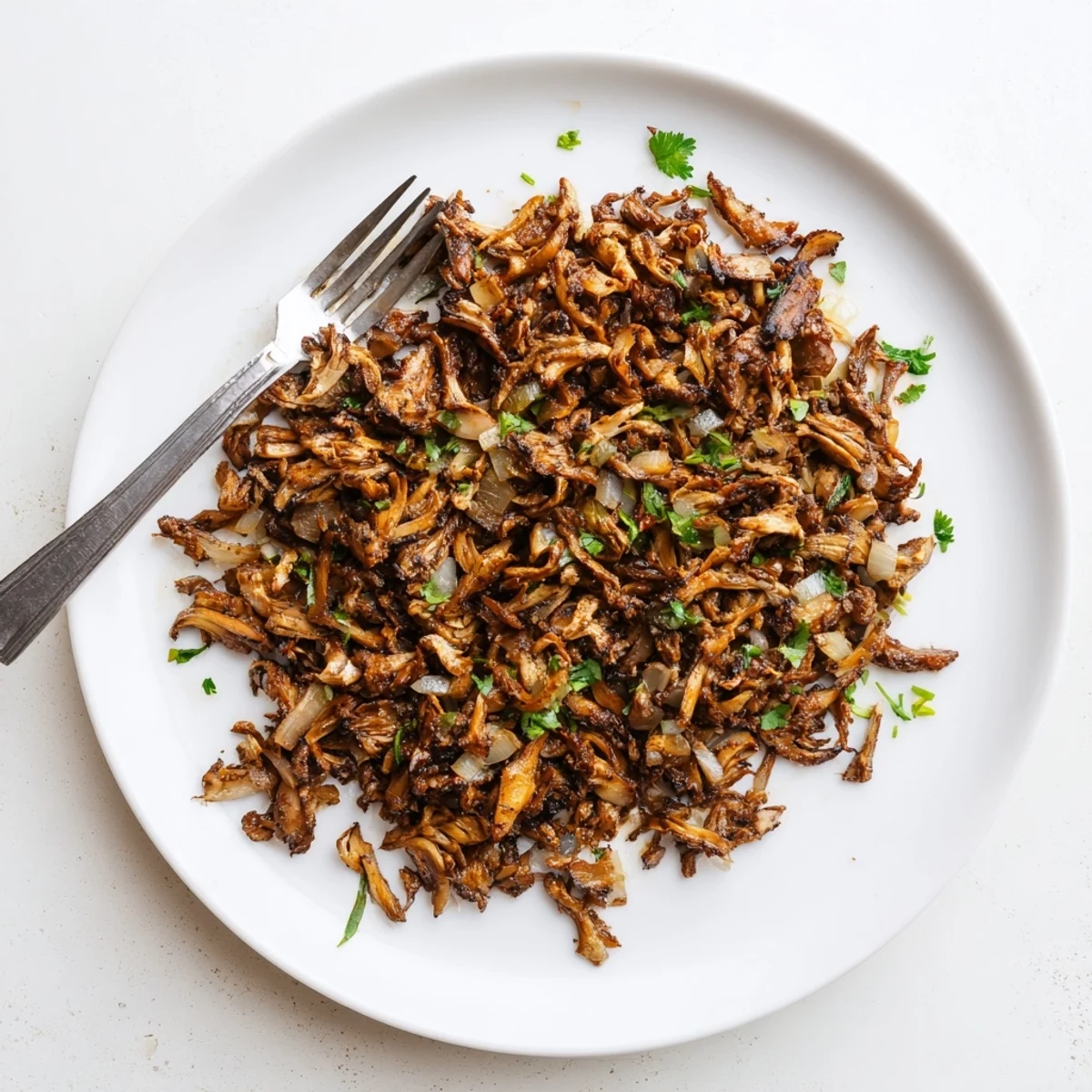 Savory mushroom carnitas spiced with cumin and paprika served with fresh cilantro