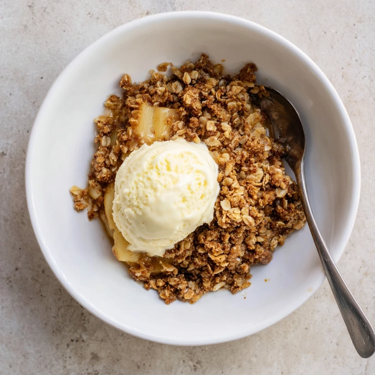 Warm crockpot apple crisp with gooey cinnamon apples and golden oat topping