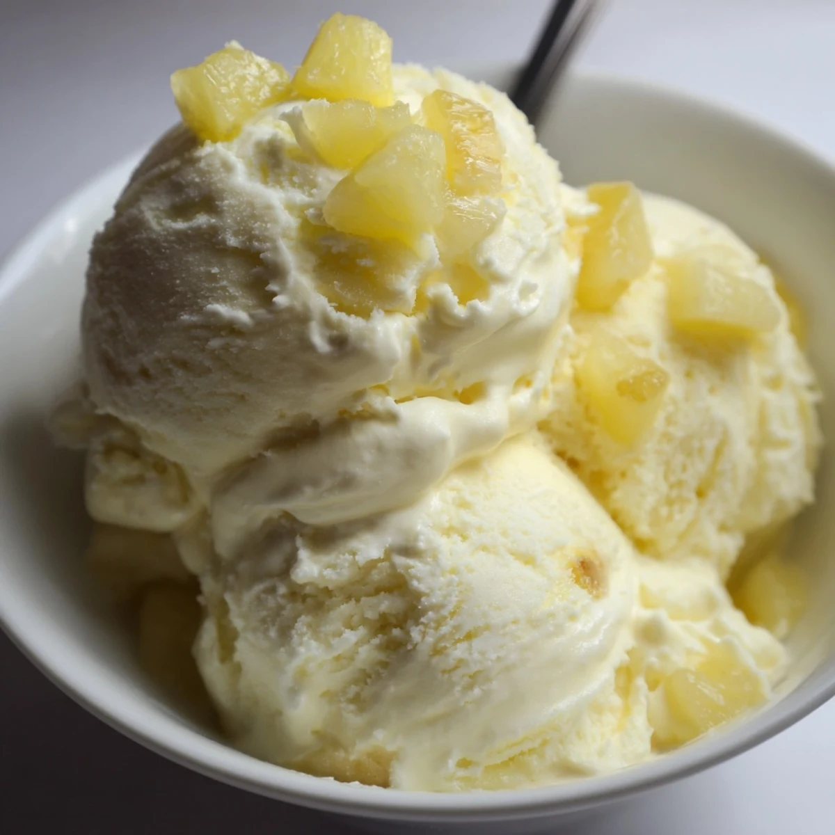 Homemade Creamy Pineapple Ice Cream Recipe churned to soft, scoopable perfection