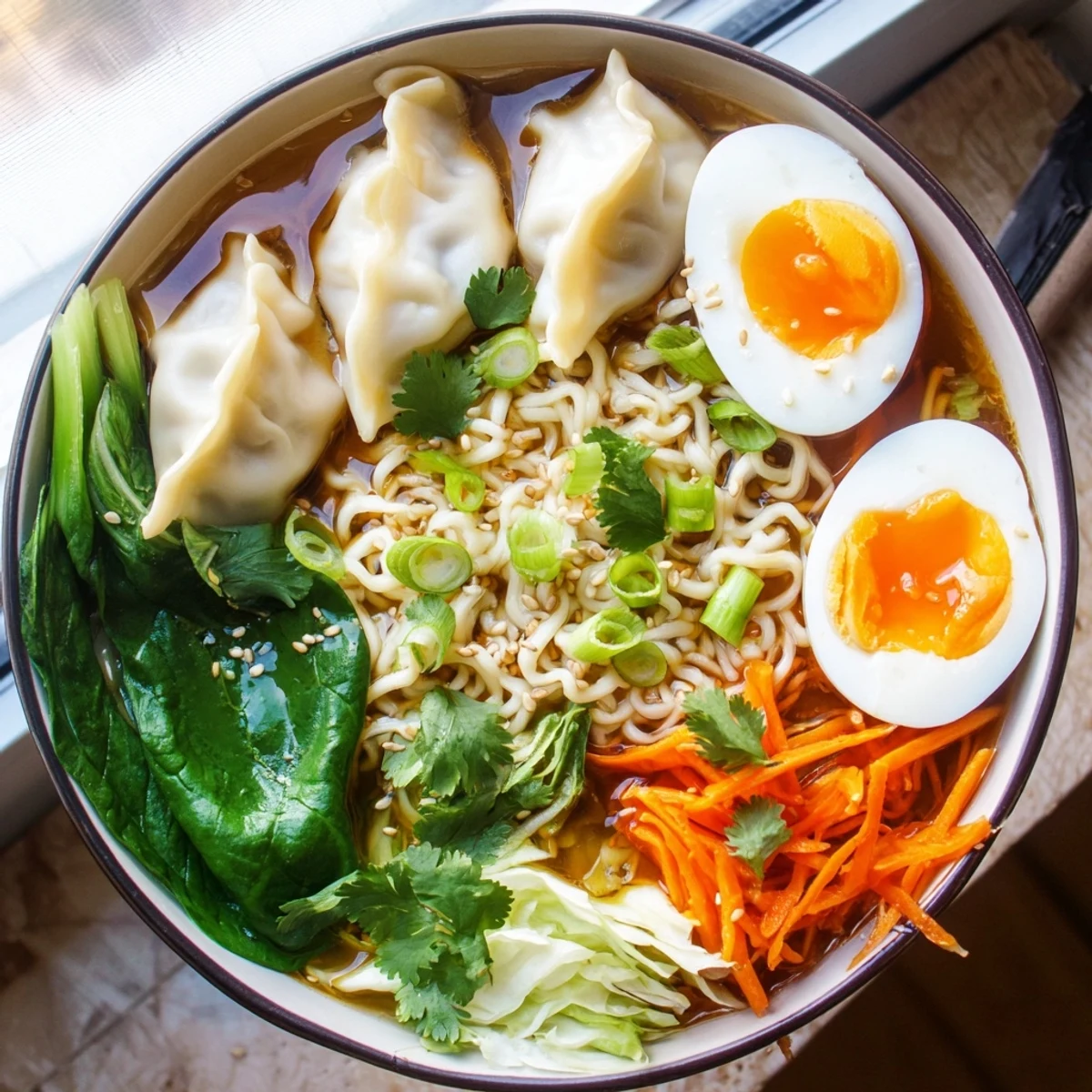 Steaming bowl of dumpling ramen featuring tender soft-boiled eggs and vibrant fresh greens in savory broth