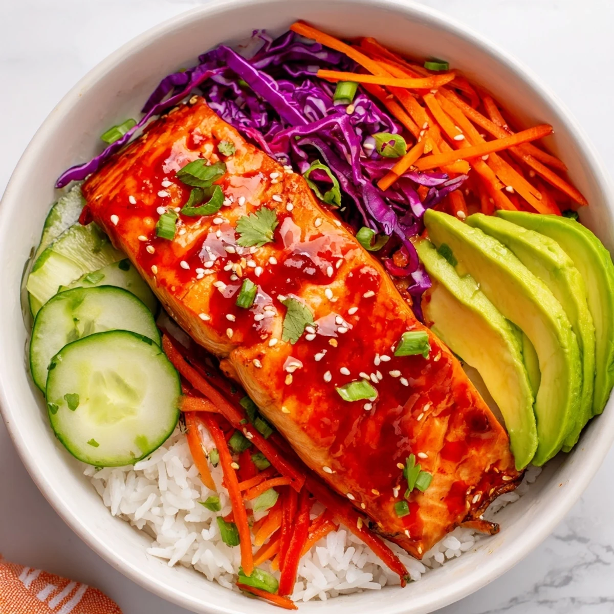 Crisp colorful veggies and tender glazed salmon in Sriracha Honey Glazed Salmon Bowls