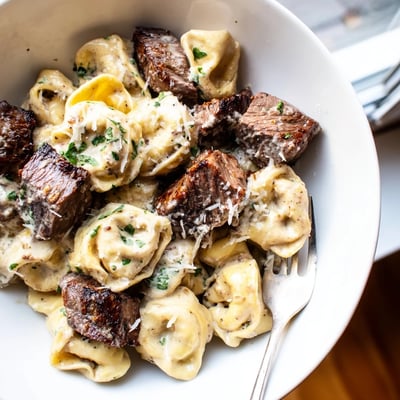 Golden seared steak bites nestled in cheesy garlic steak tortellini with rich cream sauce